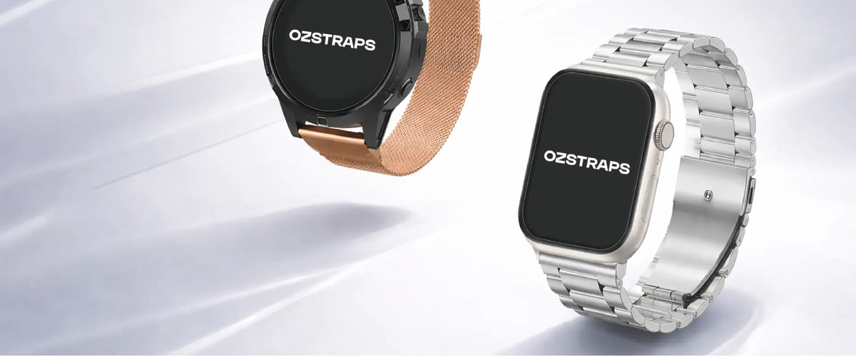 Apple Watch with a silver stainless steel link band next to a round smartwatch with a rose gold Milanese band